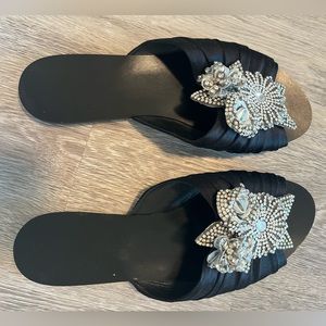 Black slip on sandal with embellishment